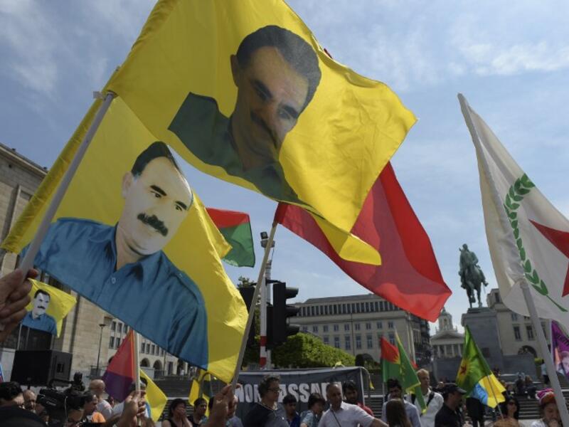 Kurdish protesters wave flags of the PKK organization during a demonstration against Turkish military operations. (AFP/File)