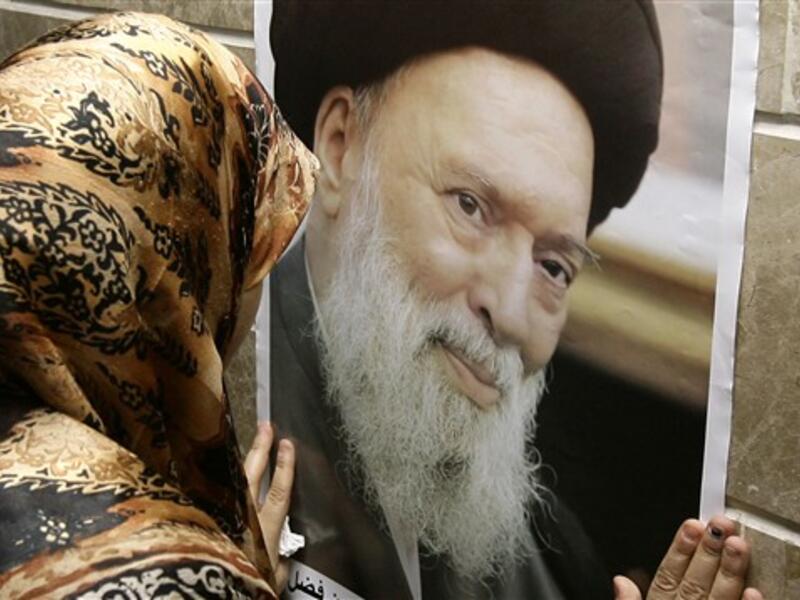 LEBANON, Beirut : A Shiite woman mourns the death of the late Grand Ayatollah Sayyed Mohammed Hussein Fadlallah (photo) at a mosque where his funeral is being held in Beirut's southern suburb on July 4, 2010, following his death earlier today at the age of 75 from internal bleeding an aide said. 