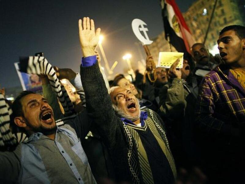 An Egyptian opposition supporter shouts political slogans as hundreds of protesters demonstrated against President Mohammed Morsi in Cairo's landmark Tahrir square on Tuesday. (AFP PHOTO/MAHMOUD KHALED)
