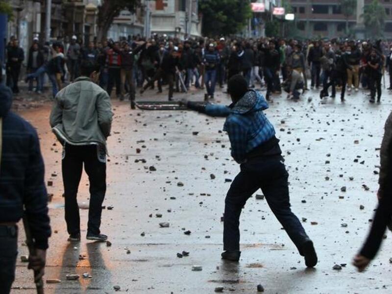 Egyptian opponents and supporters of President Morsi clash in Alexandria on Thursday. (AFP)