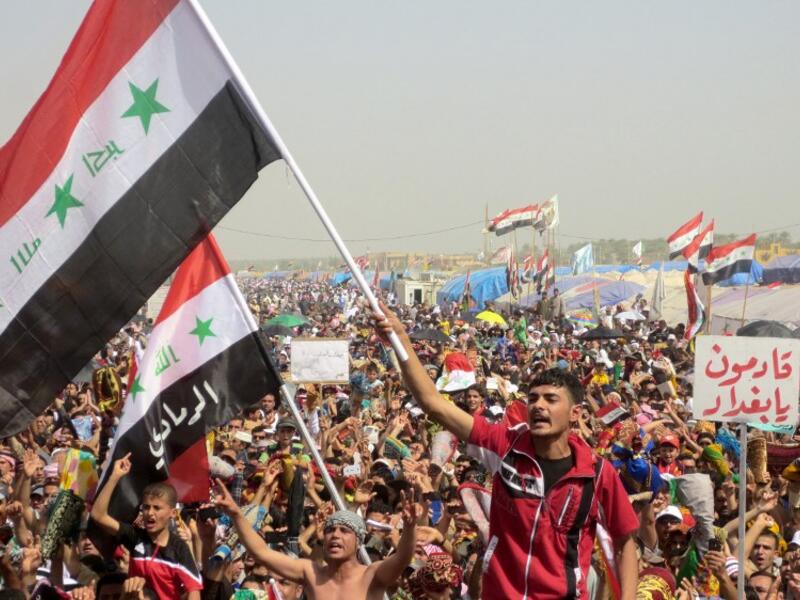 Iraqi demonstrators shout slogans during an anti-government protest in the western city of Ramadi on Friday. (AFP PHOTO/AZHAR SHALLAL)