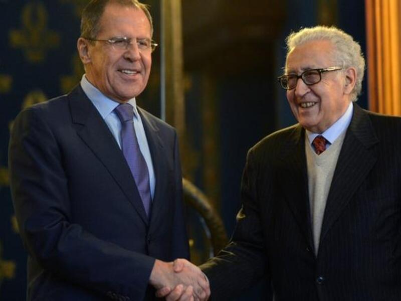 Russian Foreign Minister Sergei Lavrov (L) shakes hands with UN-Arab League peace envoy Lakhdar Brahimi as they arrive for talks in Moscow, on Saturday. (AFP PHOTO / KIRILL KUDRYAVTSEV)