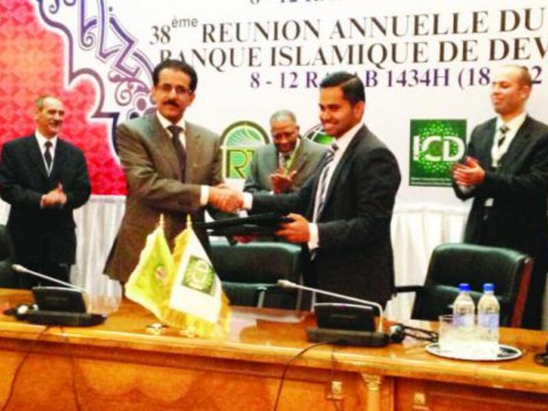 Thomson Reuters and ICD announce the joint development of the Islamic Finance Development Indicator. Ahmad Mohamed Ali, president of the IDB Group, center, looks on.