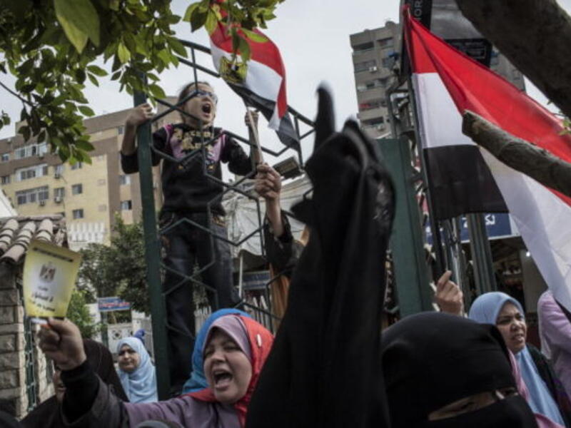 Egypt is a society divided by Morsi's moves and the referendum
