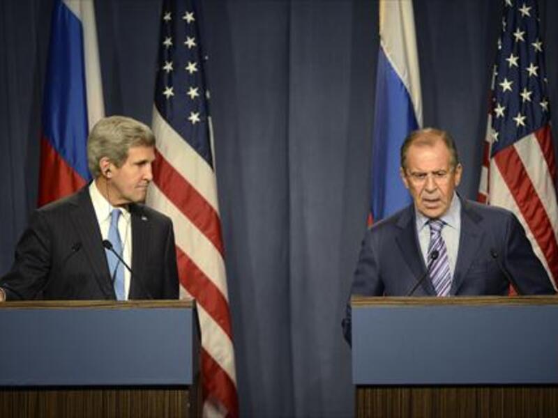 Is Russia winning the war in Syria by presenting itself as a global leader? US Secretary of State John Kerry (L) and Russian Foreign minister Sergei Lavrov (R) give a press conference in Geneva following their meeting on Syria's chemical weapons. (AFP)