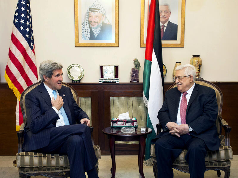 Kerry's meeting with Abbas in Amman comes ahead of the tentative fourth and final release of pre-Oslo Palestinian prisoners scheduled for the end of this month (File Archive/AFP)
