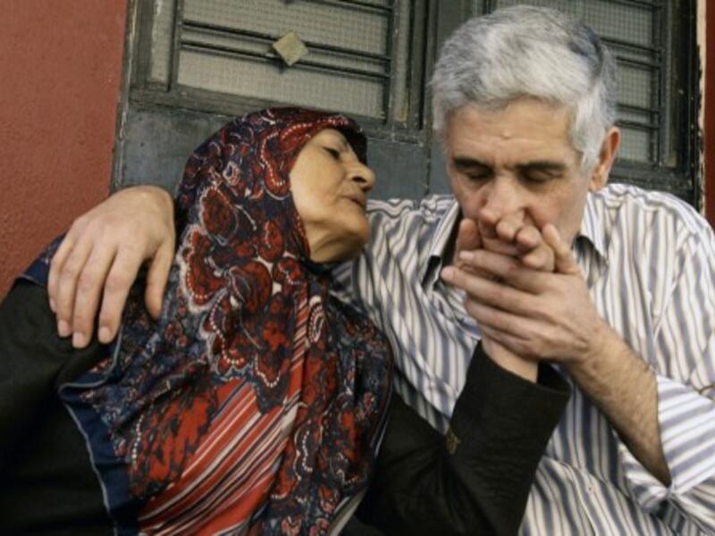 Abbas Hammoud, one of the nine Lebanese pilgrims held hostage in Syria for 17 months, is welcomed by his mother Mayla Aldurr upon his arrival at his home in the coastal city of Tyre in south Lebanon on October 20, 2013. On Wednesday, an activist announced that the Syrian authorities had released 14 women detained in the country as part of a hostage exchange deal. (AFP)