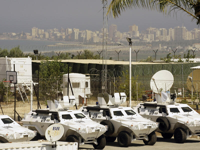 Vehicles of the United Nations Interim Force in Lebanon (UNIFIL) are parked at the Turkish engineering construction company's base on August 10, 2013 in the southern Lebanese village of Saitah. (AFP/MAHMOUD ZAYYAT)