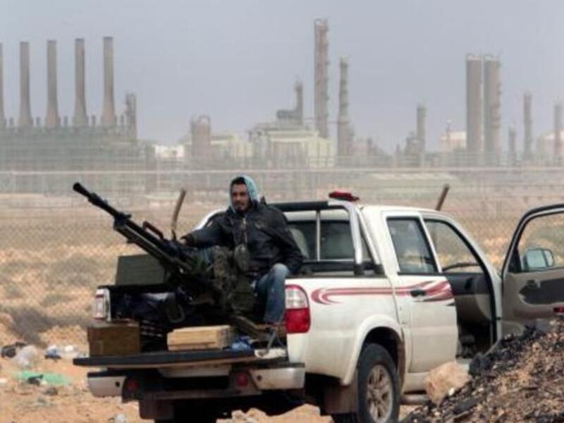 The anniversary of the uprising that ended with Qaddafi’s killing in October 2011 comes as Libya’s new rulers battle critics calling for a 'new revolution.'