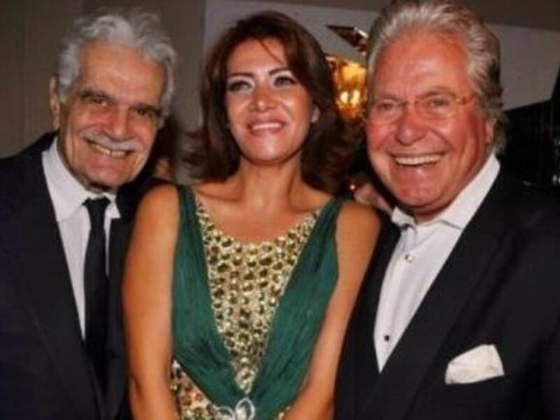 Hussein and ex-wife Liqa pose with legendary actor, Omar Sharif