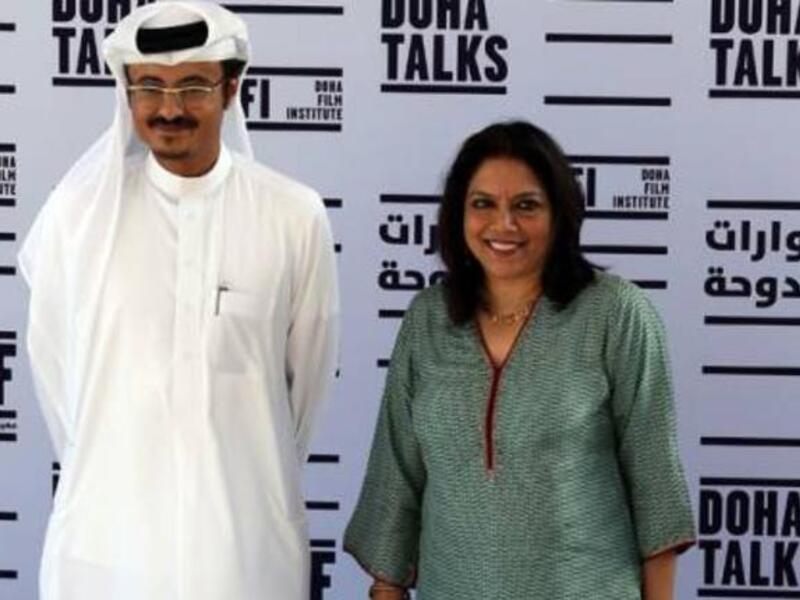 Indian film director of "The Reluctant Fundamentalist" Mira Nair stands along side Abdul Aziz Al Khater, the Chief Executive Officer of the Doha Tribeca Film Festival in the Qatari capital, on November 17, 2012.