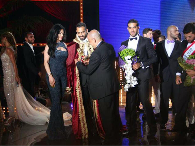 The moment Ayman Moussa was crowned as Mr. Lebanon alongside singer Haifa Wehbe. (Image: Facebook)