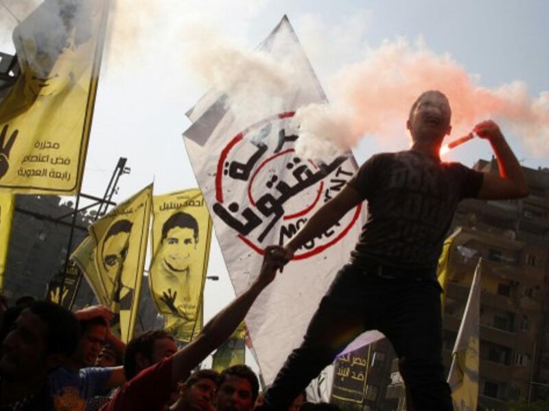 Supporters of Egyptian ousted president Mohamed Morsi and of the Muslim brotherhood movement demonstrate against the military in Cairo's eastern Nasr City district. (AFP)
