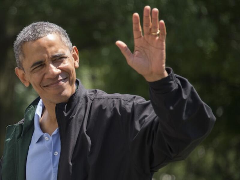 President Barack Obama waves as he returns to the White House in Washington on August 4. (AFP)