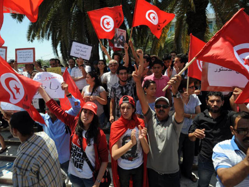 Tunisians have been calling for new government leadership and the oust of Ennahda since MP Mohammed Brahmi's assassination in July (File Archive/AFP)