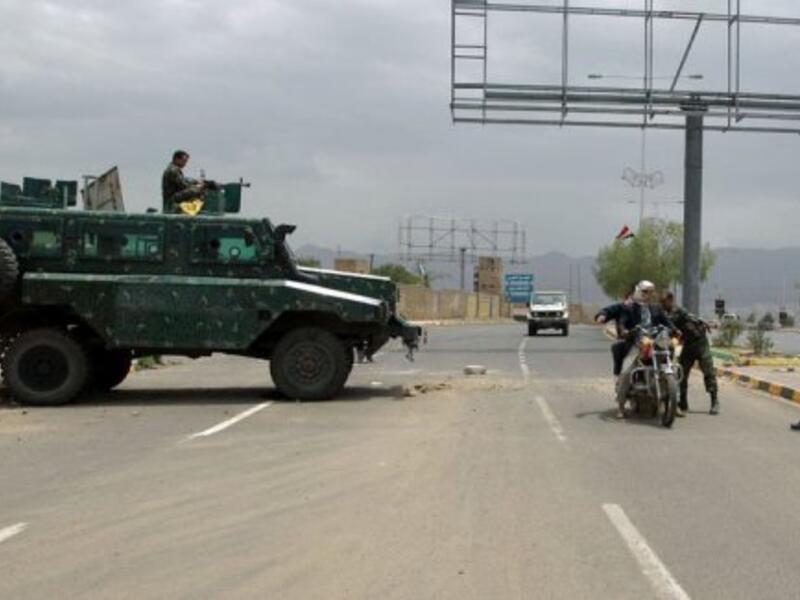 Yemeni soldiers search a motorbike at a checkpoint on a street leading to the US embassy in Sanaa on August 4, 2013 (AFP/File)