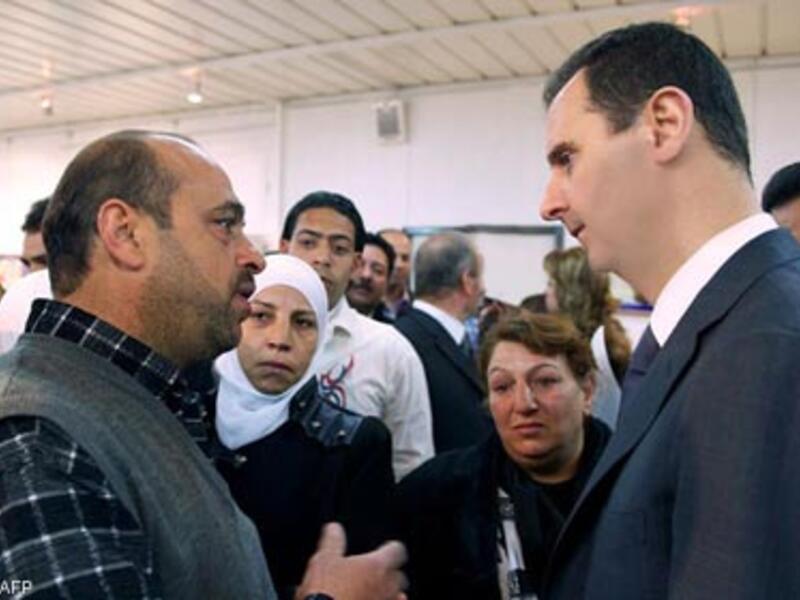 Syrian President Assad makes a rare public appearance at an electrical plant in Damascus. (image AFP/Uprooted Palestinians)