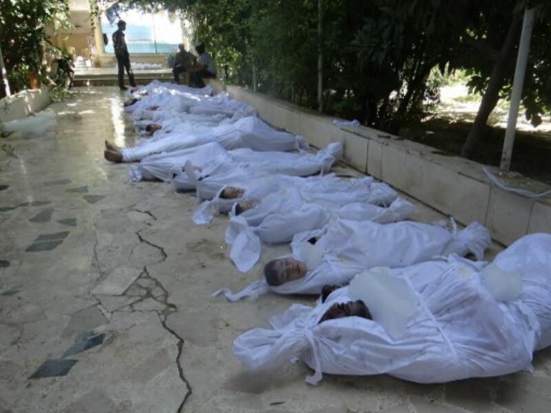 Bodies of children killed in the August chemical attacks lie in a makeshift morgue in Damascus on August 22, 2013. A recent study shows that 11,420 children have died in the Syrian conflict so far (AFP/File)