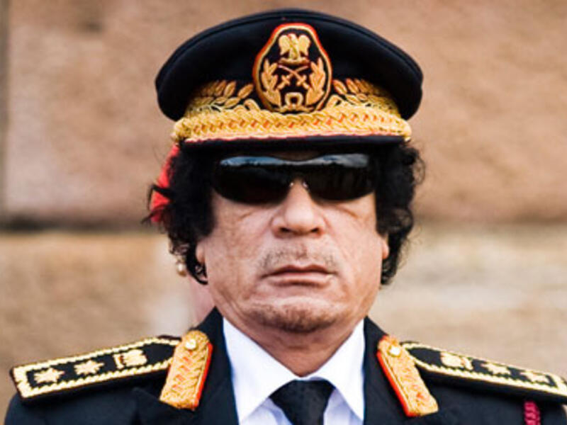 Turning in his grave: former Libyan leader Muammar Gaddafi was allegedly an active sexual abuser of young girls, kidnapping and imprisoning them at a young age for his own sexual desires, according to a new tell-all book published on the dictator. (AFP/File)