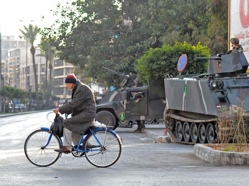 The war in Syria has spilled over into Lebanon, heightening sectarian tension and violence particularly within the northern city of Tripoli (Ibrahim Chalhoub/AFP)