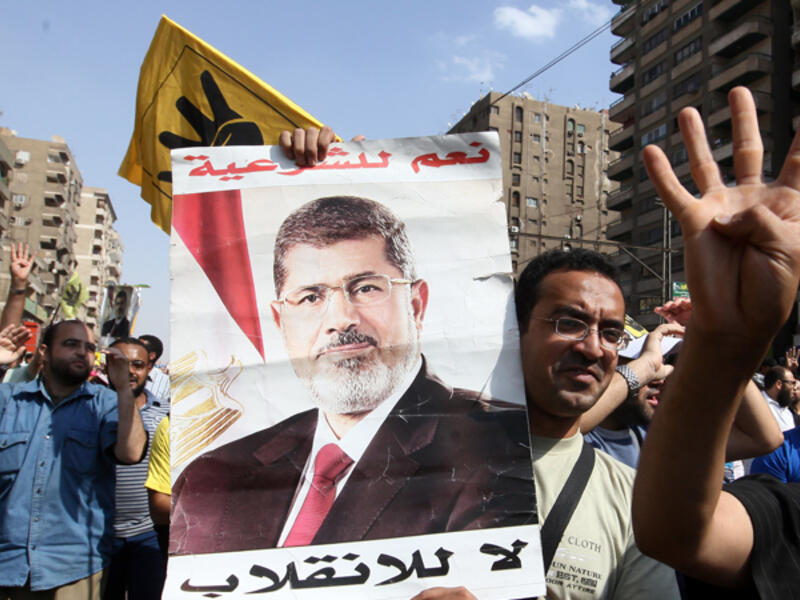 "I am the legitimate president," Morsi shouted during his trial in Cairo on Tuesday. (AFP/File)