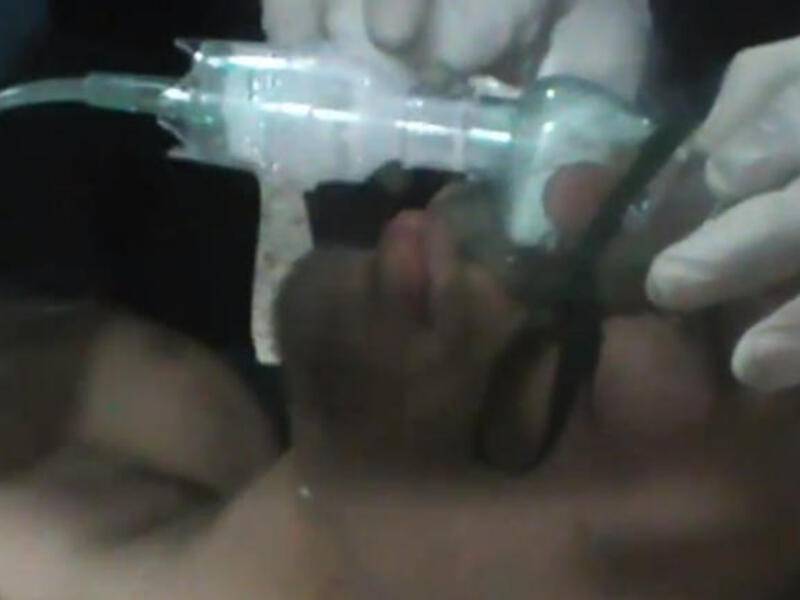 Pictured: Patient in Homs allegedly suffering from gas poisoning. (Screen grab taken from Youtube)