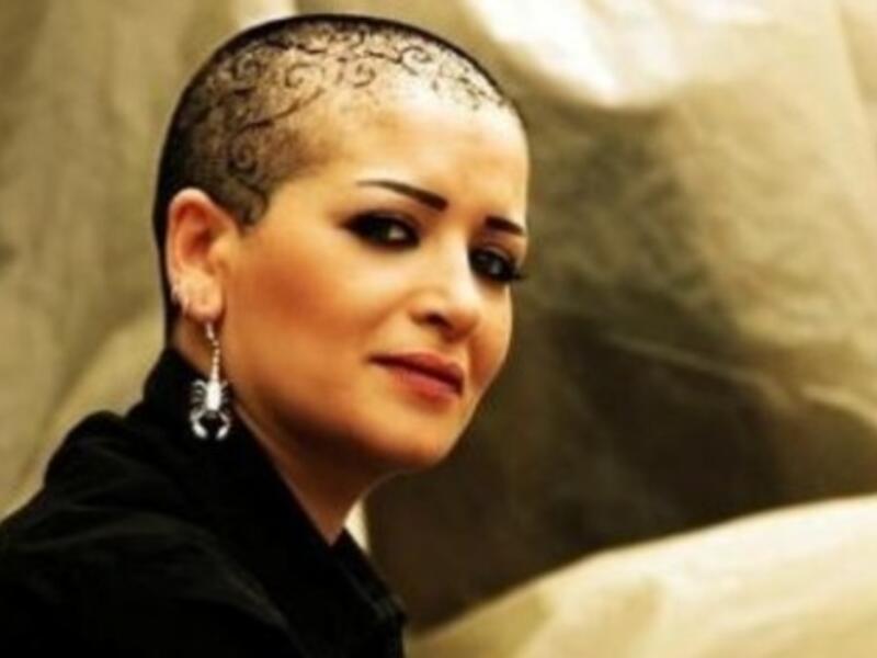 Syrian actress, Suzan Skaf, in her new shaved head look. (Photo courtesy Sayidaty)
