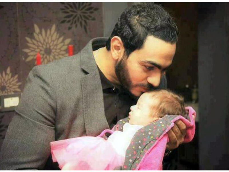 Image of Tamer with his daughter courtesy of www.alonota.com