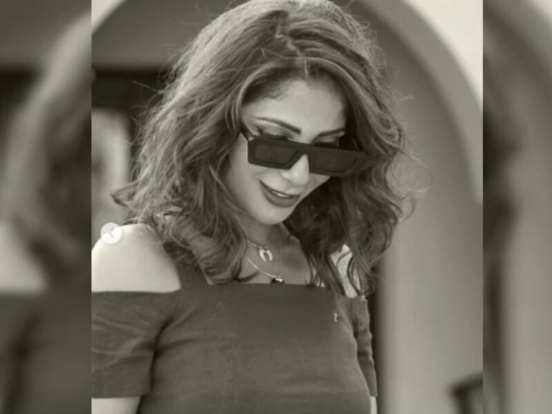 She added a thick bracelet, sunglasses and high heeled sandals as accessories