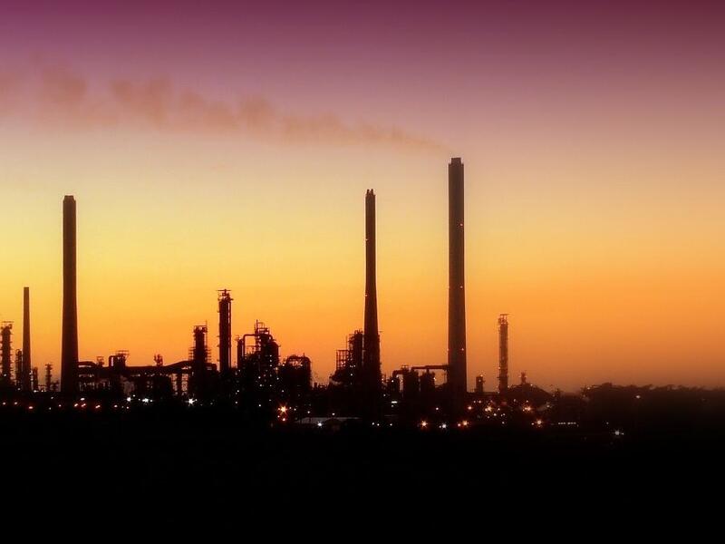 An oil refinery draws out the skyline. (Twitter)