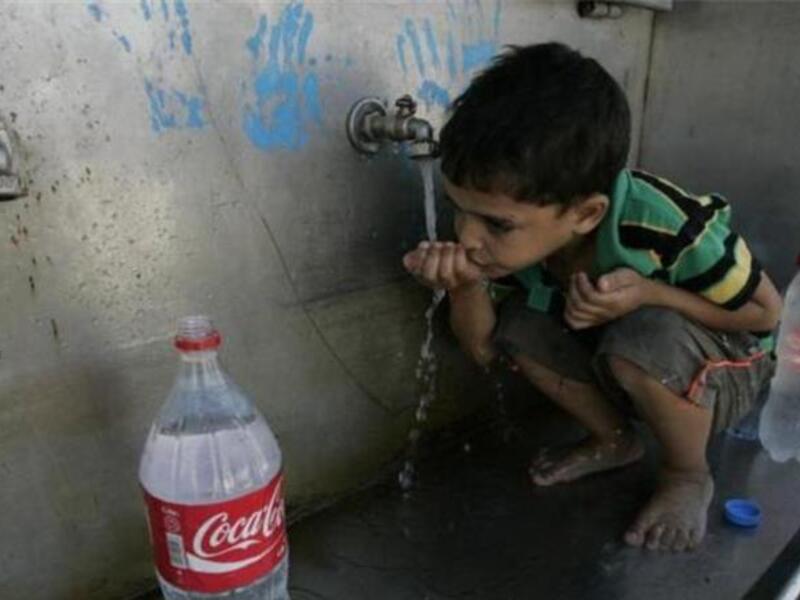 A Palestinian boy drinking water in the Gaza Strip. (AFP/File)