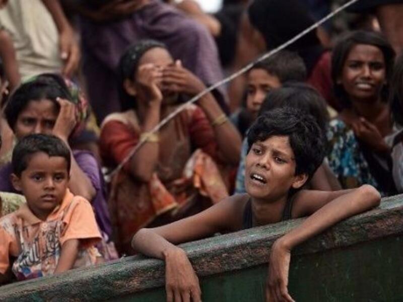 Rohingya Muslims flee violence in Myanmar (AFP/File Photo)