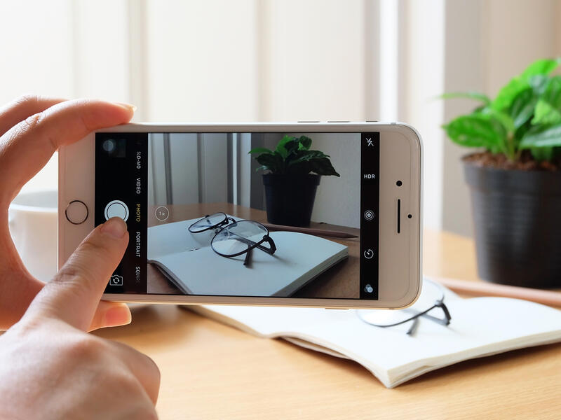 An Apple iPhone 7 plus taking a photo. (Shutterstock)