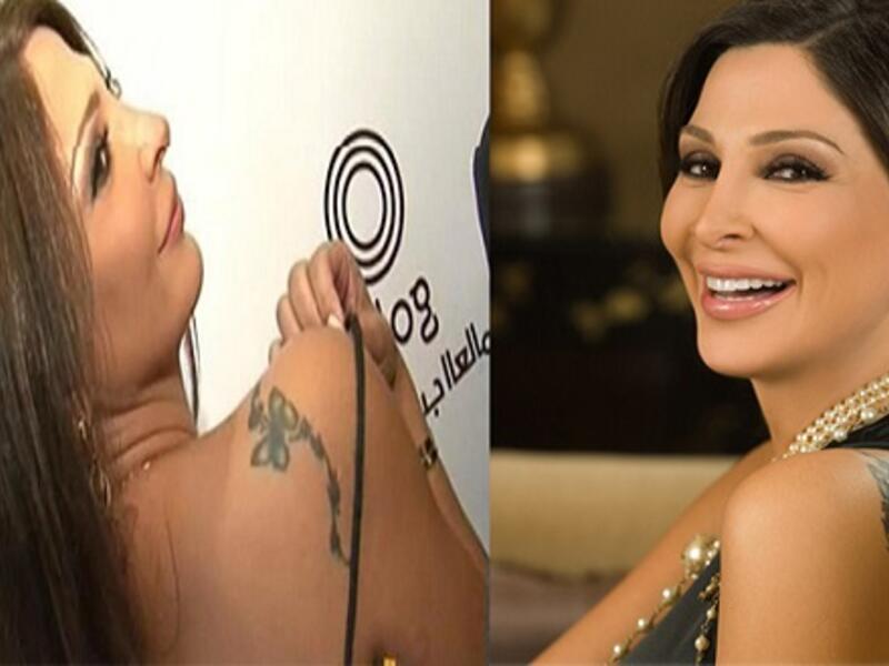 ملكة الرومانسية إليسا وشمت على كتفها تاتو على شكل فراشة.