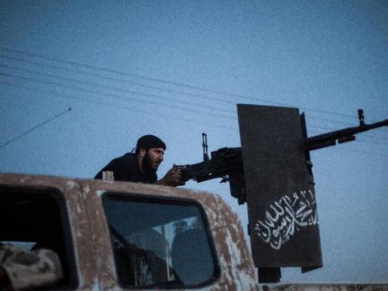 Ahrar al-Sham was founded in late 2011 and became a force on the Syrian battlefield in 2012. Here a member is seen firing during clashes in the Raqqa province. (AFP/Alice Martins)