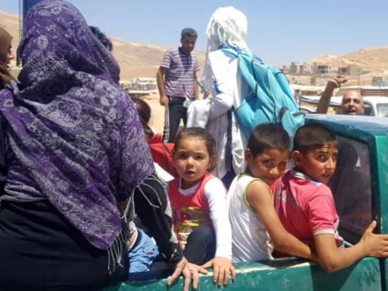 Syrian refugees arrive in Wadi Hamayyed, on the outskirts of Lebanon’s northeastern border town of Arsal. (AFP/ File Photo)