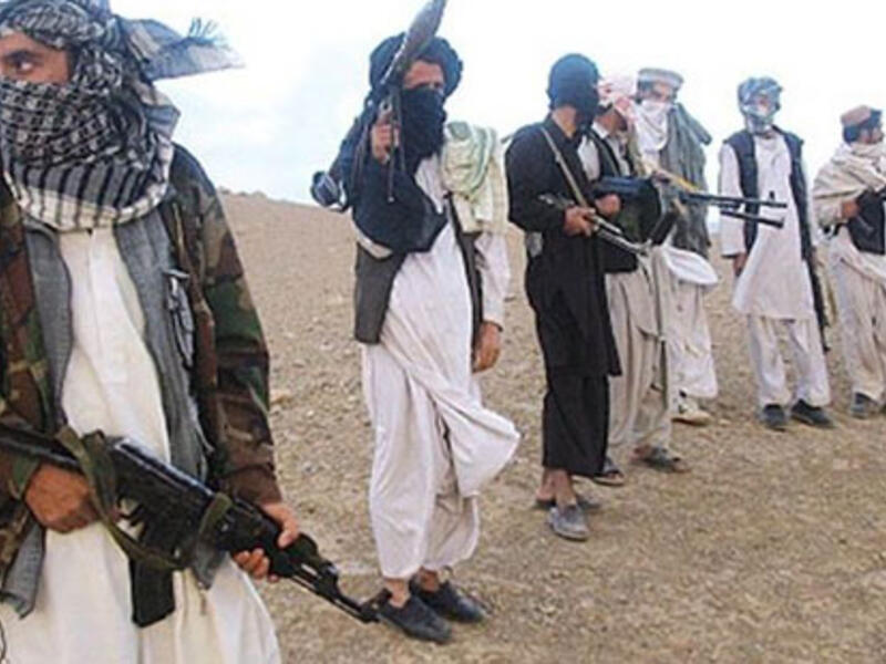 Taliban militants killed 18 Afghan soldiers, beheading eight, and possibly abducted others after they stormed an army outpost. (AFP/File)