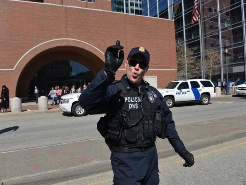 Police evacuate the area around the Boston courthouse after a bomb (AFP/ Stan Honda)