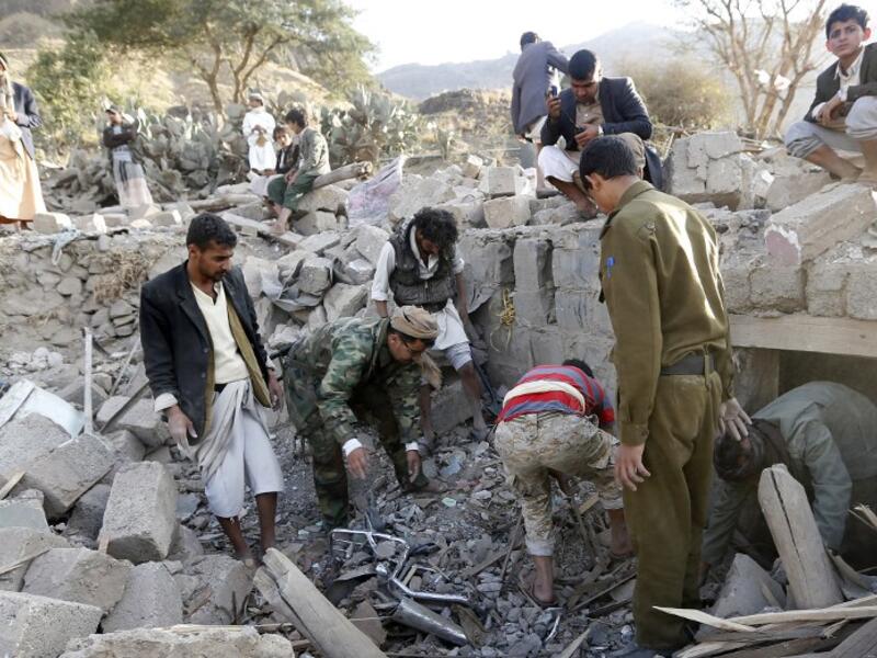 Yemenis search under the rubble of damaged houses following reported Saudi-led coalition air strikes on the outskirts of the Yemeni capital Sanaa on February 1, 2017. (AFP/Mohammed Huwais)