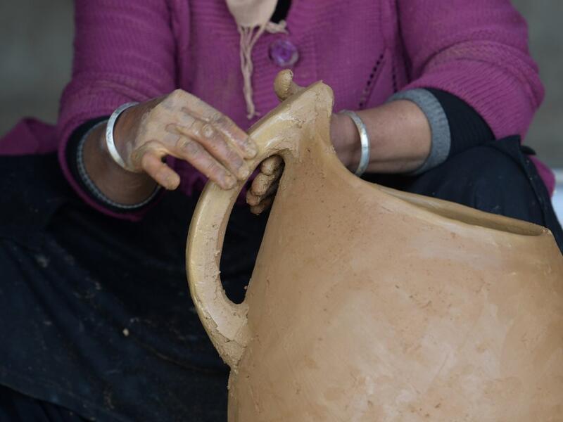 Sabiha Ayari, a Tunisian potter in her fifties, works in the village of Sejnane in the northern Tunisian province of Bizerte, about 120 kilometres (75 miles) west of the capital Tunis.  FETHI BELAID / AFP