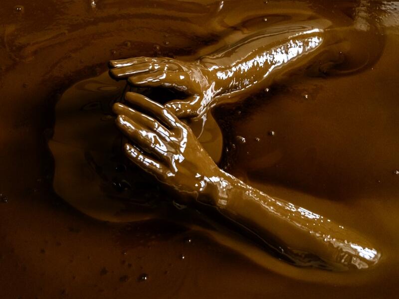 A man bathes in a tub filled with Naftalan crude oil during a treatment session at Sehirli Naftalan Health Center, some 300 kilometres (186 miles) from capital Baku, on March 21, 2019. Immersed up to her neck in crude oil, a Russian woman suffering from joint disease smiles in delight, confident that the treatment at a spa in northwestern Azerbaijan will cure her painful condition.  Mladen ANTONOV / AFP
