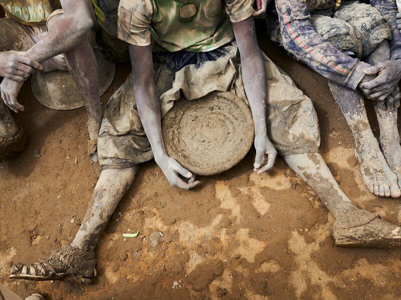 People take part in the annual rendering of the Great Mosque of Djenne in central Mali  MICHELE CATTANI / AFP