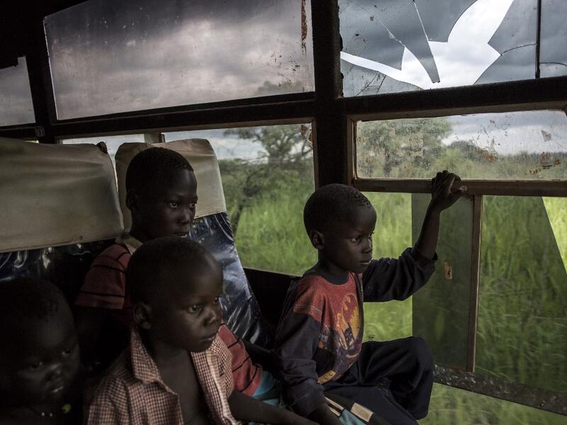 Young South Sudanese refugees are transported from the border of South Sudan and the Democratic Republic of the Congo (DRC) to a refugee settlement site. JOHN WESSELS / AFP