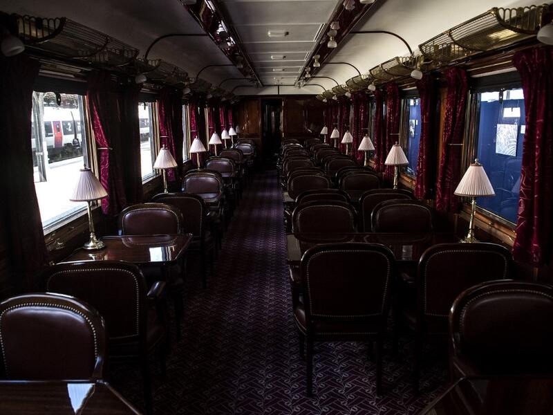 This picture taken on May 13, 2019 shows the interior of a restored carriage of an Orient Express train displayed at the Gare de l'Est train station in Paris.  Christophe ARCHAMBAULT / AFP