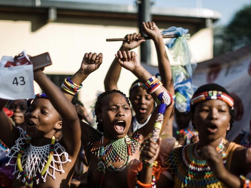 Young women dressed up in traditional attire sing and chant during an audition organised by the Indoni Culture School in the South African city of Durban. Rajesh JANTILAL / AFP