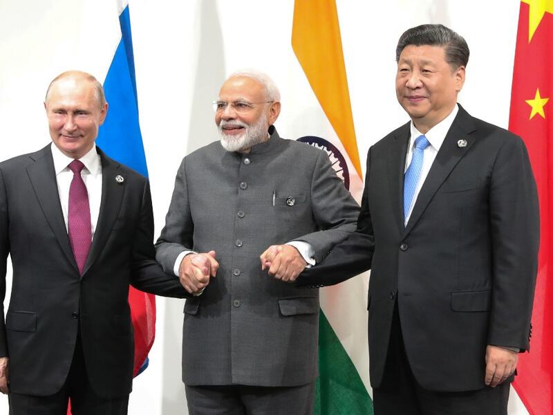 Russian President Vladimir Putin, Indian Prime Minister Narendra Modi and Chinese President Xi Jinping hold a meeting on the sidelines of the G20 summit in Osaka on June 28, 2019.  Mikhail KLIMENTYEV / SPUTNIK / AFP