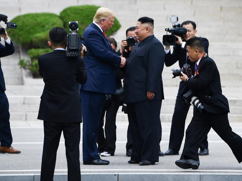 North Korea's leader Kim Jong Un shakes hands with US President Donald Trump north of the Military Demarcation Line that divides North and South Korea, in the Joint Security Area (JSA) of Panmunjom in the Demilitarized zone (DMZ) on June 30, 2019.  Brendan Smialowski / AFP