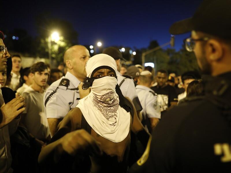Crowds of Ethiopian-Israelis battled police and blocked highways in at least 10 junctions across the country beginning in the late afternoon, with over a dozen protesters detained and thousands of motorists held motionless in huge traffic jams.  MENAHEM KAHANA / AFP