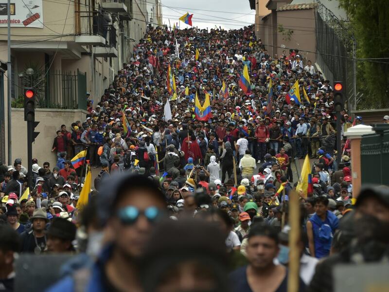 Protesters march against President Lenin Moreno's decision to slash fuel subsidies, in Quito on October 9, 2019. Unions and other groups alongside thousands of farmers and indigenous people are expected in the streets of the capital Quito. 