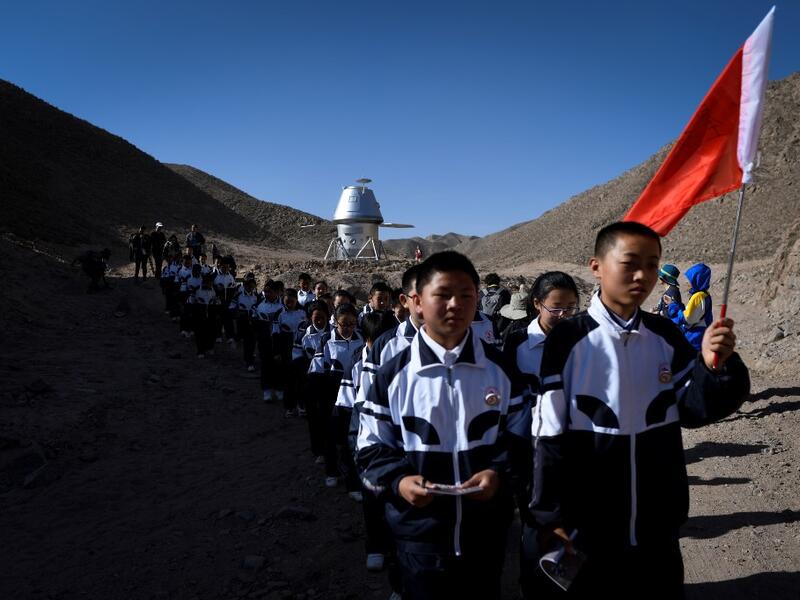 Surrounded by barren hills in northwest Gansu province, "Mars Base 1" opened to the public on April 17 with the aim of exposing teens -- and soon tourists -- to what life could be like on the planet. WANG ZHAO / AFP